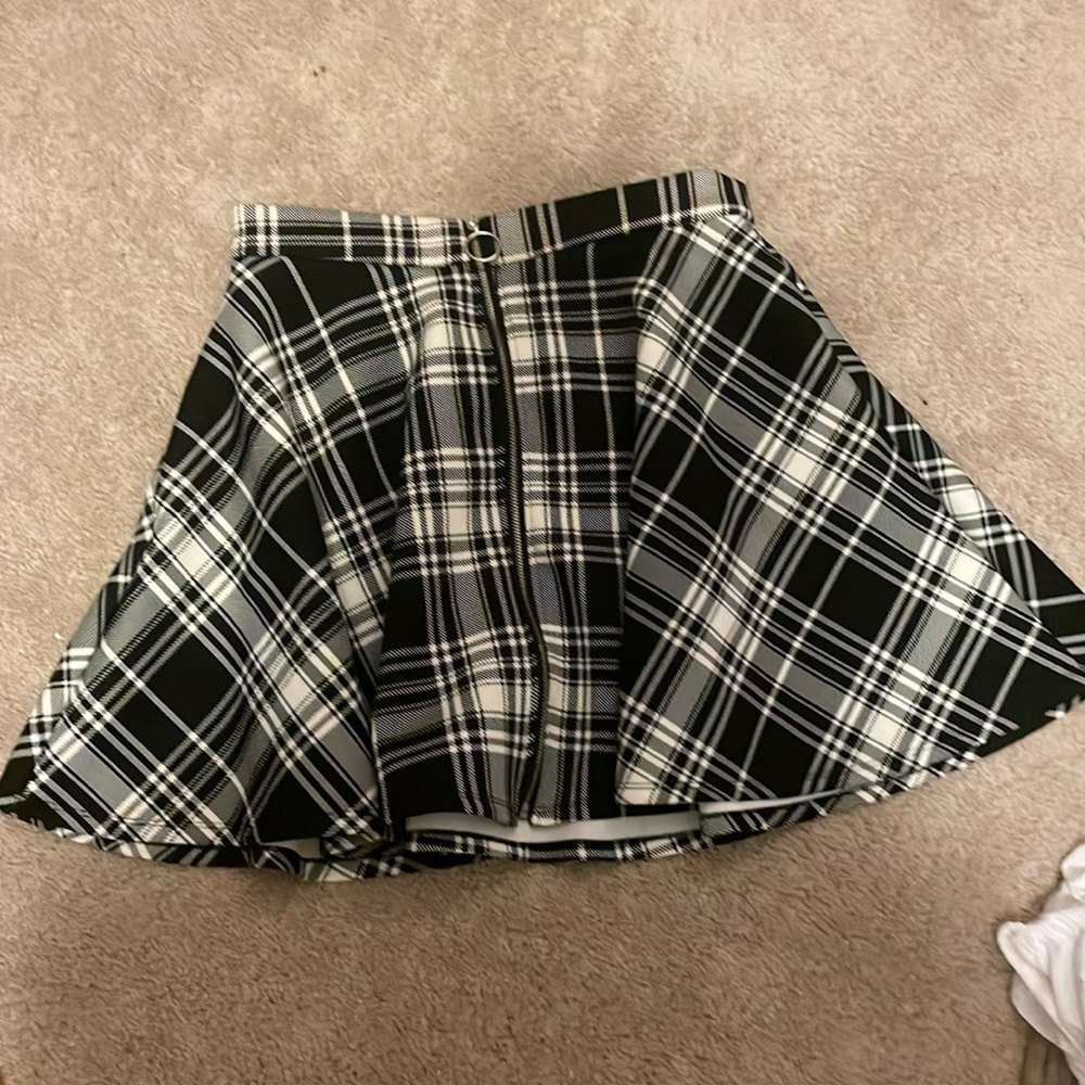 Plaid, black, and white skirt.